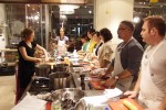 Chef Christianne cutting up an onion as the class looks on. Chef Christianne cutting up an onion as the class looks on.