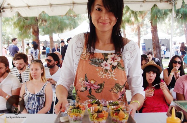 Saki hands out samples to the hungry group