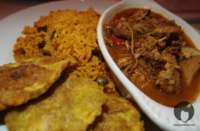 Pollo guisado and tostones y arroz con gandules